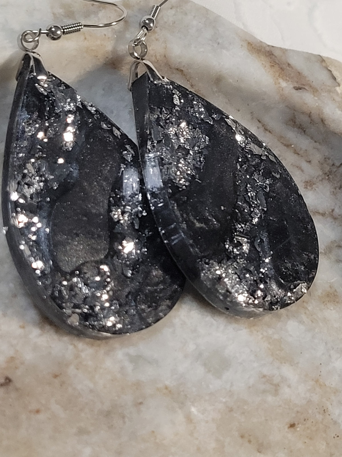 Black and silver swirl resin dangle earrings