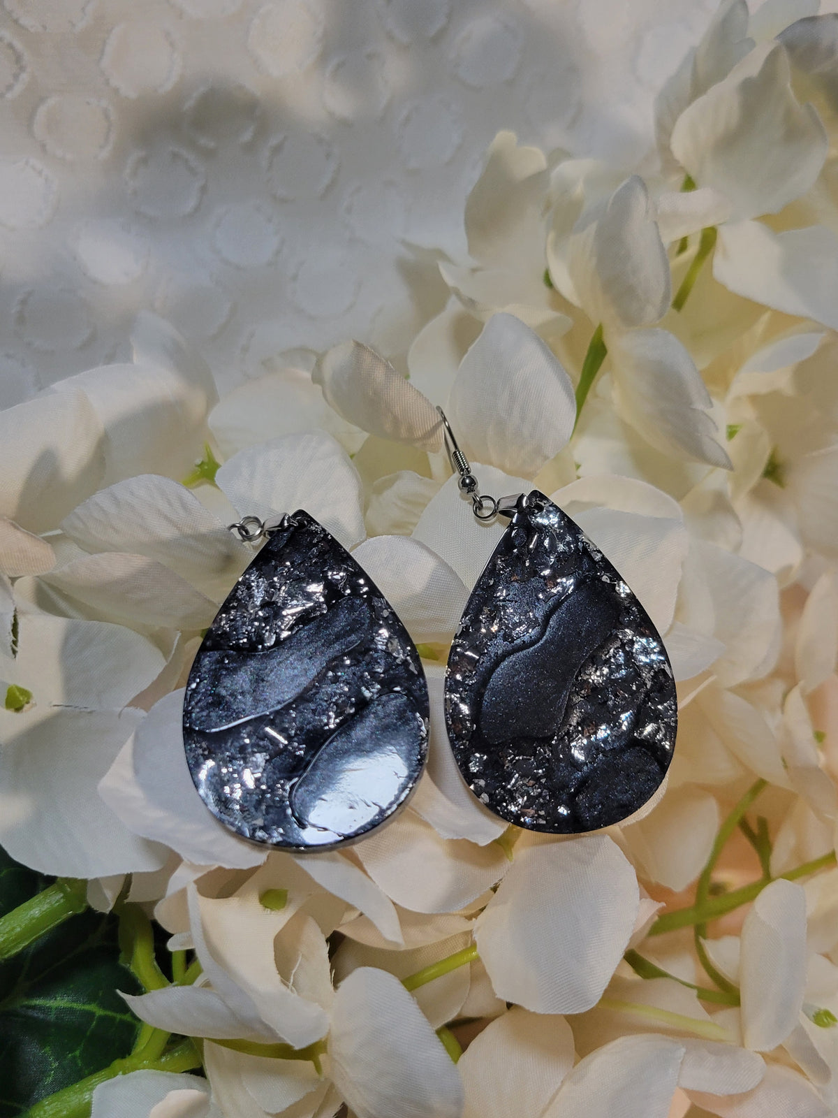 Black and silver swirl resin dangle earrings