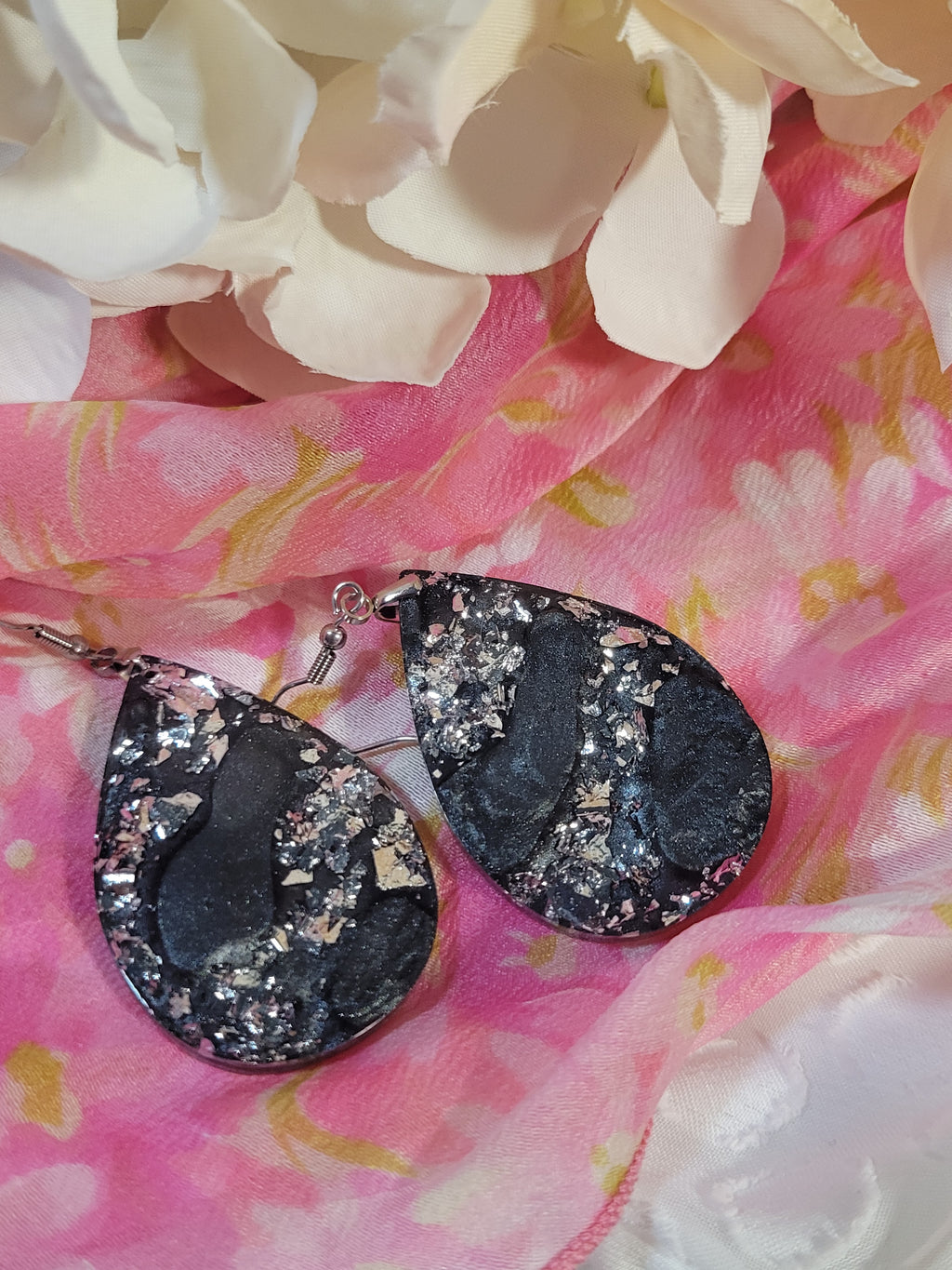 Black and silver swirl resin dangle earrings