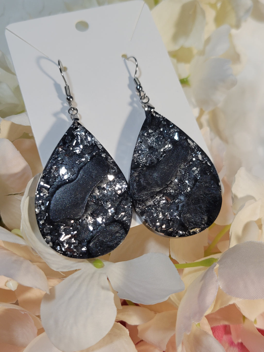 Black and silver swirl resin dangle earrings